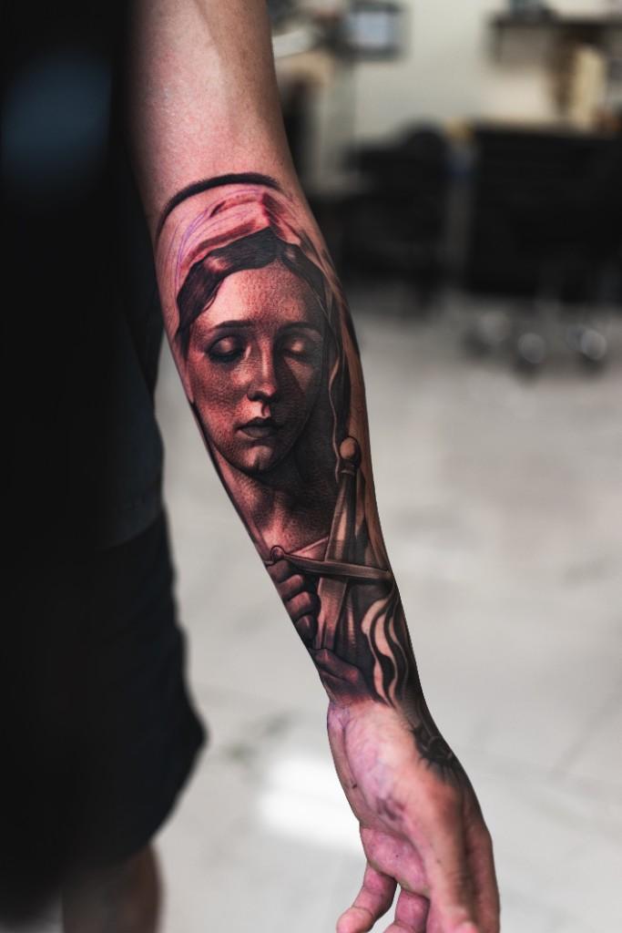 Classical portrait with sword forearm tattoo